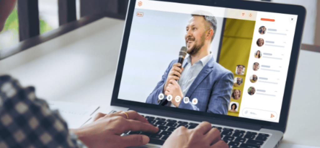 person watching a live-broadcasted presentation from their laptop